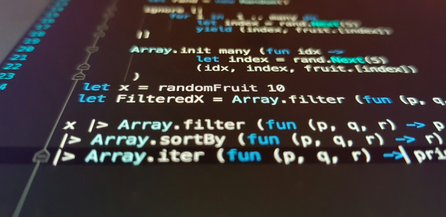 Computer screen shows lines of code in a programming language.